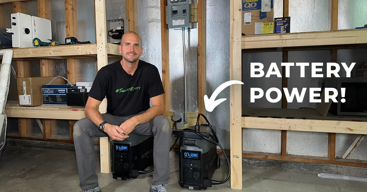 An image of Scott sitting in his off-grid garage with the words "BATTERY POWER!" and an arrow pointing to two EcoFlow Delta Pros.
